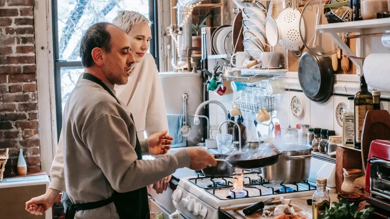 Family cooking together in a bright kitchen
